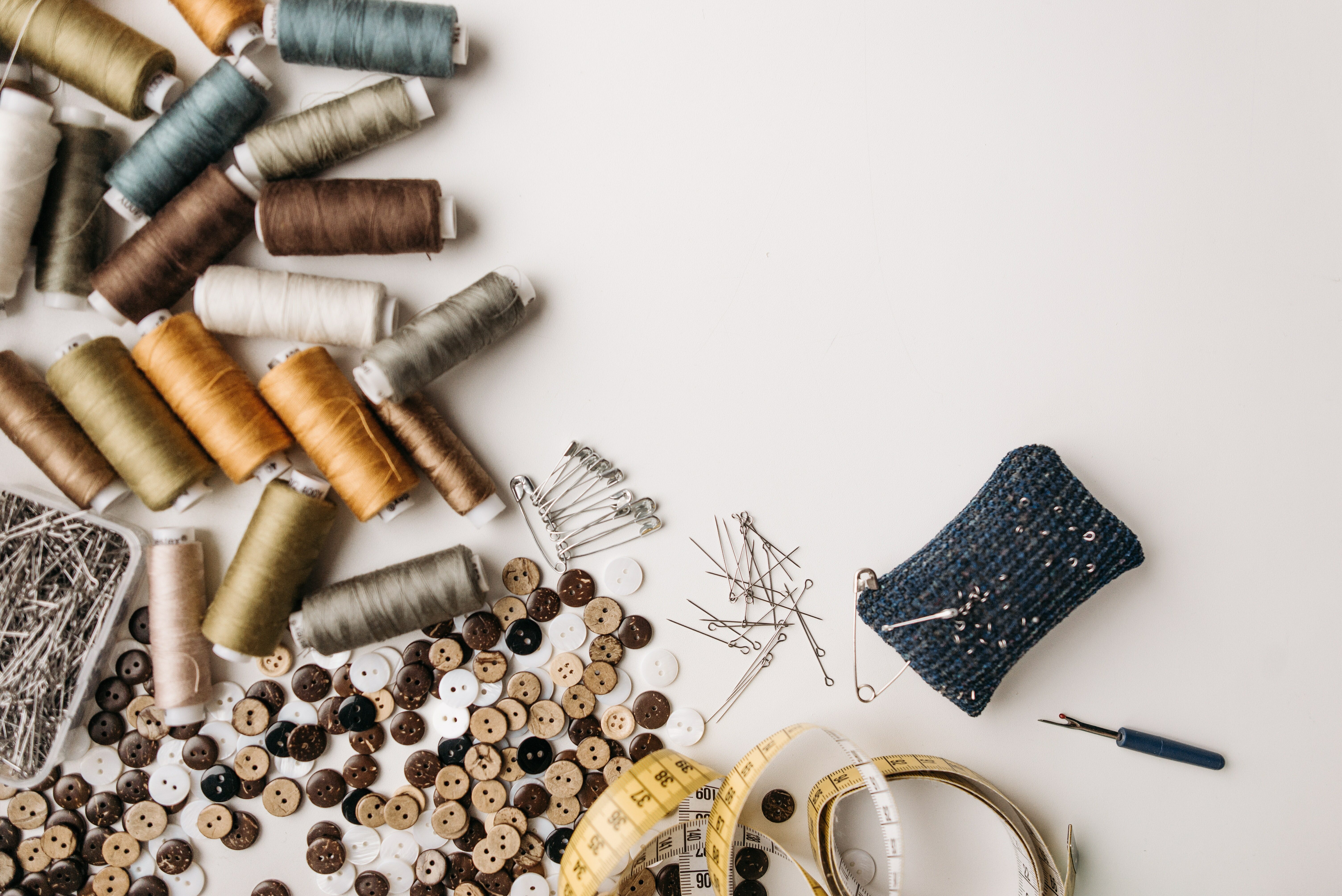 Tailoring table with buttons and accessories